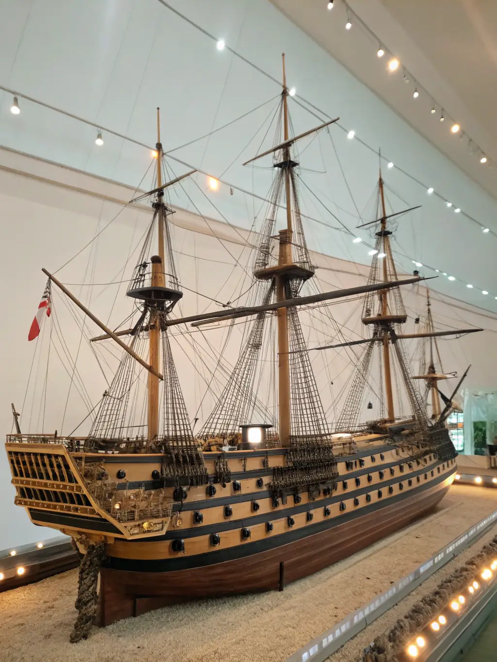The Hermione sailing on the open sea, with a focus on the ship's majestic appearance and historical accuracy.